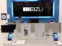 A shop assistant waits for customers at a Meizu store