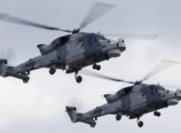 AgustaWestland Wildcat HMA.2 helicopters of the Black Cats Helicopter Display Team, of the British Royal Navy Fleet Air Arm, take part in a display during the Malta International Airshow at Malta International Airport, outside Valletta, Malta, September 2