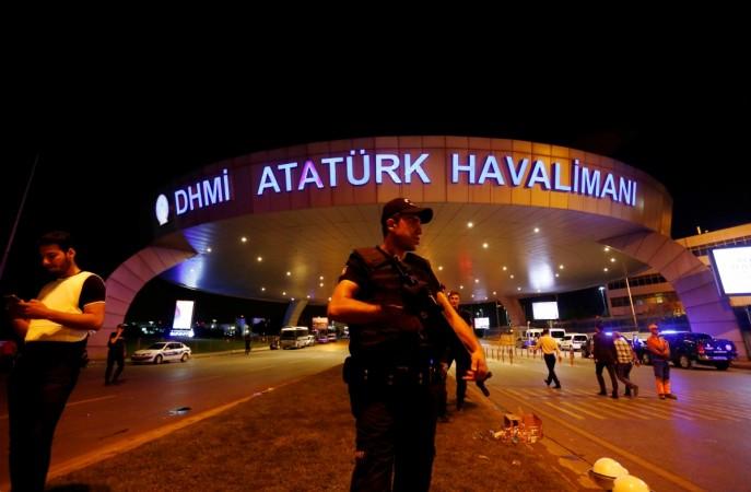 A riot police officer stands guard at the entrance of the Ataturk airport in Istanbul, Turkey, following a multiple suicide bombing, early June 29, 2016.