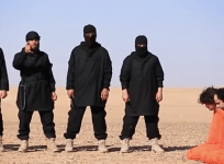 Syria: Video shows Isis militants beheading five people suspected of being spies, putting up their heads on metal pegs