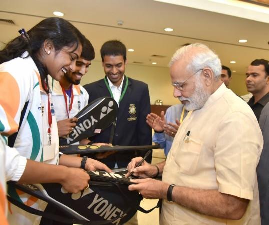 PM Modi seen with PV Sindhu before the Indian contingent headed to Rio de Janeiro for Olympics 2016 pm modi olympics