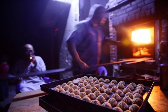 Pictured: Men prepare traditional sweets ahead of the Eid al-Fitr holiday marking the end of Ramadan in the rebel held besieged town of Douma, eastern Ghouta in Damascus, Syria, July 3, 2016. Eid