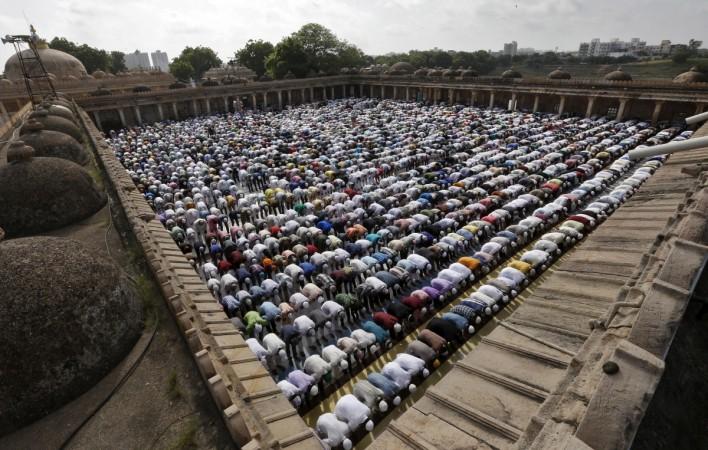 Why do Muslims sacrifice animals during Eid al Adha?