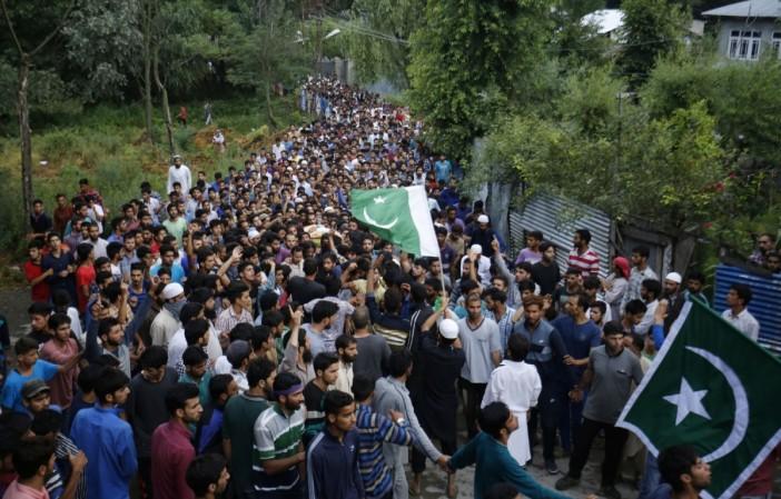 People attend funeral procession of militant Burhan Wani at his village in Tral of Jammu and Kashmir`s Pulwama district on July 9, 2016.