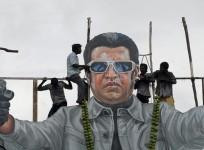 Fans of south Indian film star Rajinikanth pour milk as an offering over his cut-out