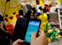 A man plays the augmented reality mobile game
