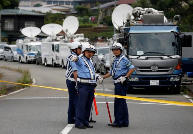 Police officers stand guard at a facility for the disabled, where a deadly attack by a knife-wielding man took place, in Sagamihara, Kanagawa prefecture, Japan, July 26, 2016.