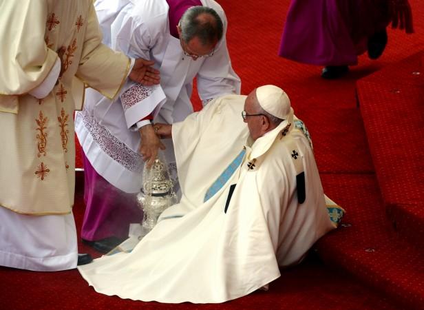 Pope Francis is helped after falling as he arrives at the Jasna Gora shrine in Czestochowa, Poland, on July 28, 2016.