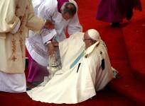 Pope Francis is helped after falling as he arrives at the Jasna Gora shrine in Czestochowa, Poland, on July 28, 2016.
