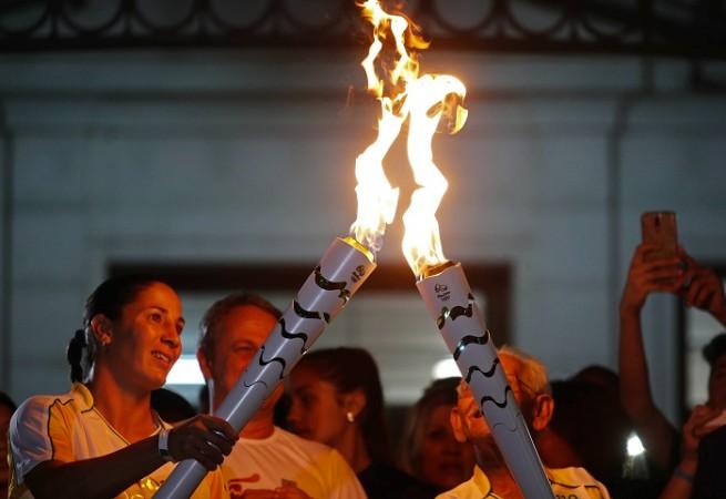 Rio Olympics torch security reviewed by Brazil after riot - IBTimes India