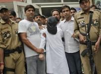 Sayeed Zabiuddin Ansari, with his face covered, leaves from a hospital in New Delhi June 29, 2012.