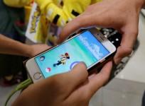 Men play the augmented reality mobile game