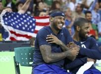 Carmelo Anthony of the USA and team mate Kyrie Irving celebrate.