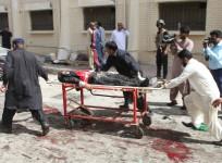 First responders and volunteers transport the injured and dead away from the scene of a bomb blast outside a hospital in Quetta, Pakistan, on Aug. 8, 2016.