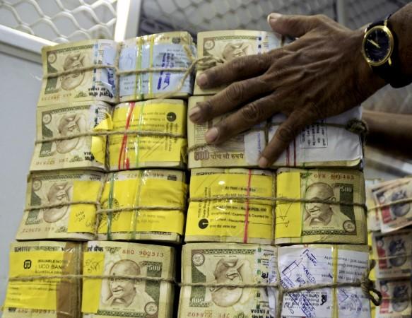 aap mla raid income tax cash seizure recovery aap bjp clash recovery unaccounted wealth black money
