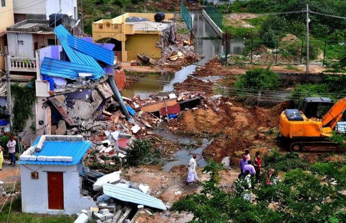 bbmp demolition drive officials bengaluru bangalore it city silicon valley india infosys intel wipro encroachment land developers sobha prestige adarsh