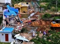 bbmp demolition drive officials bengaluru bangalore it city silicon valley india infosys intel wipro encroachment land developers sobha prestige adarsh