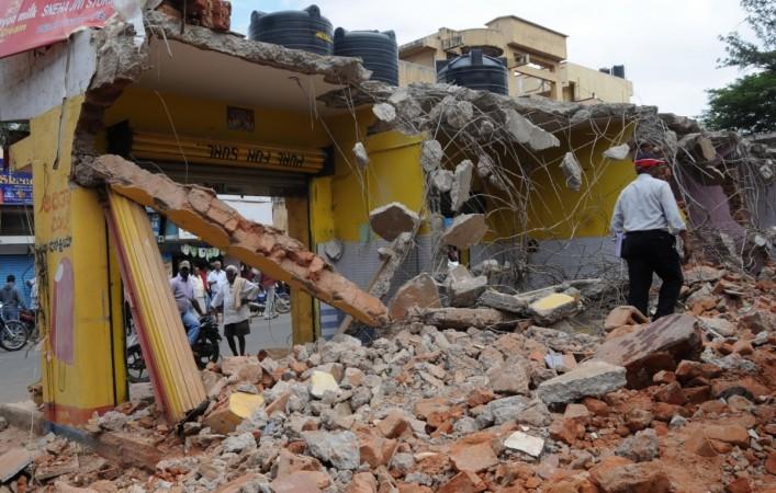 bbmp demolition drive officials bengaluru bangalore it city silicon valley india infosys intel wipro encroachment land developers sobha prestige adarsh section 288d constitution right to property