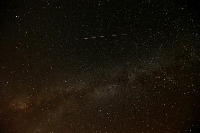 A meteor streaks across the sky in the early morning during the Perseid meteor shower in Ramon Crater near the town of Mitzpe Ramon, southern Israel, August 12, 2016. Perseid meteor shower 2016