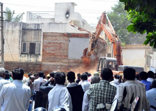 bbmp demolition drive officials bengaluru bangalore it city silicon valley india infosys intel wipro encroachment land developers sobha prestige adarsh