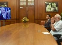 Prime Minister Narendra Modi greets Afghanistan President Mohammad Ashraf Ghani during the joint inauguration of the renovated Stor Palace in Kabul through video-conferencing, in New Delhi on Aug. 22, 2016.