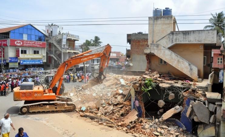 bbmp demolition drive officials bengaluru bangalore it city silicon valley india infosys intel wipro encroachment land developers sobha prestige adarsh panic residents