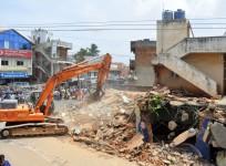 bbmp demolition drive officials bengaluru bangalore it city silicon valley india infosys intel wipro encroachment land developers sobha prestige adarsh panic residents