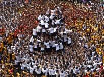 Krishna Janmashtami 2016: Top Bollywood songs to be played during the festival. Pictured: Devotees try to form a human pyramid to break a clay pot containing curd during the celebrations to mark the Hindu festival of Janmashtami.