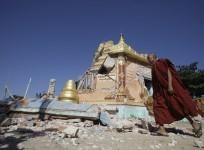 A Buddhist monk walks in front of damaged pagoda in Thabeik Kyin township Nov. 12, 2012. Aftershocks rattled central Myanmar after an earthquake that killed at least 11 people, with that toll likely to rise on Monday as several workers were missing after