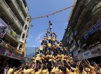 Devotees try to form a human pyramid to break a clay pot containing curd during celebrations to mark the Hindu festival of Janmashtami in Mumbai, India, Sept. 6, 2015.