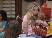 Maya blows bagpipe