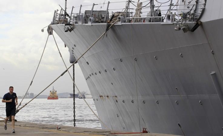 A U.S Navy officer runs next to the USS Nitze, a Guided Missile Destroyer in Rio de Janeiro on April 27, 2011.