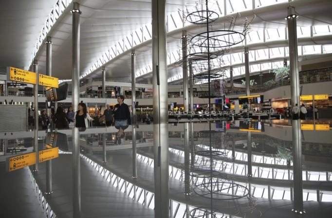 A view of the departure lounge is reflected in Terminal 2 at Heathrow Airport in London. Heathrow Airport