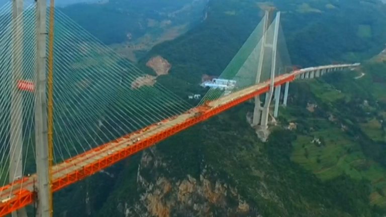 The worlds highest cable-stayed bridge is elevated 565m over a gorge ...