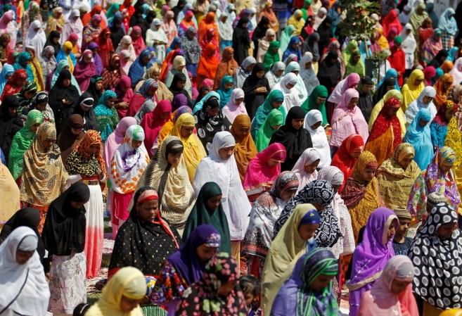 Eid al-Adha: How Bakrid is being celebrated across India Pictured: Women offer prayers at the Qutub-e-Alam shrine on the eve of the Eid al-Adha festival on the outskirts of Ahmedabad, India, Sept. 12, 2016. eid