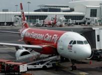 airasia india 8th aircraft 0/20 5/20 rule civil aviation market share domestic air traffic rivals tata sons tony fernandes ceo berhad loss ggg