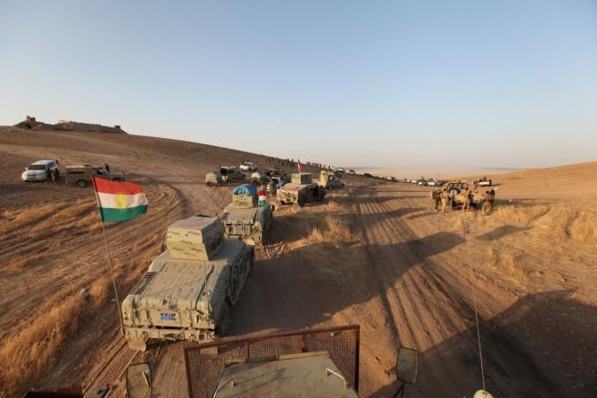 Military vehicles of the Kurdish Peshmerga forces are seen on the southeast of Mosul, Iraq, Aug. 14, 2016.