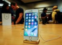 Customers take a look at the new iPhone 7 smartphone