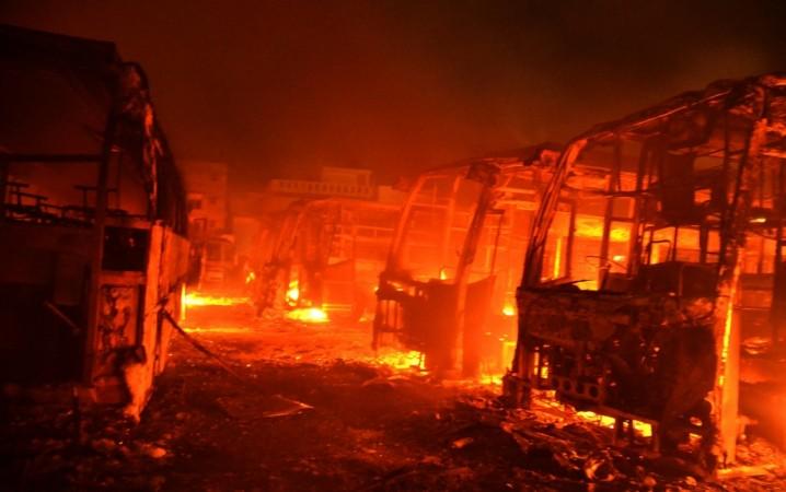 cauvery water dispute row controversy bandh bus burnt mob arson kpn travels natarajan buses woman arrested bhagyashree bengaluru strike bandh