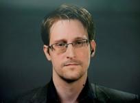 Edward Snowden speaks via video link during a news conference