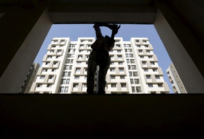 real estate construction bill workers prestige estates bangalore demolition illegal encroachment restructuring business share price developer pe investments fdi