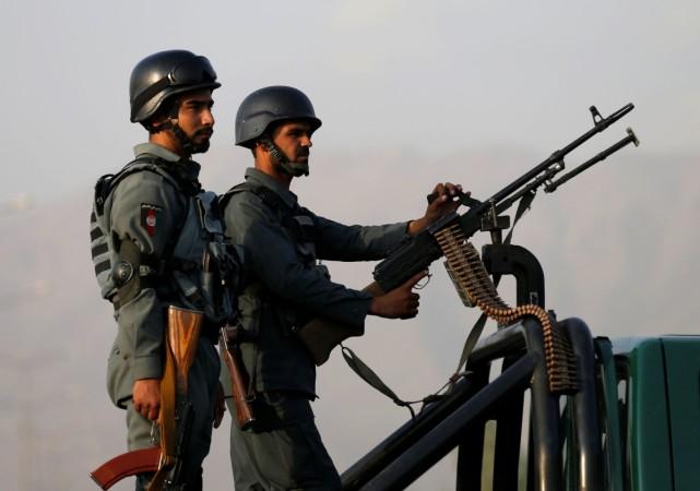 Afghan policemen stand guard in Kabul