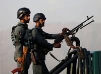 Afghan policemen stand guard in Kabul