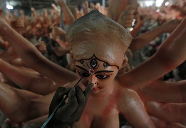 An artisan paints an idol of Hindu goddess Durga at a workshop ahead of the Durga Puja festival in Allahabad, India, September 22, 2016. Navratri and Durga Puja