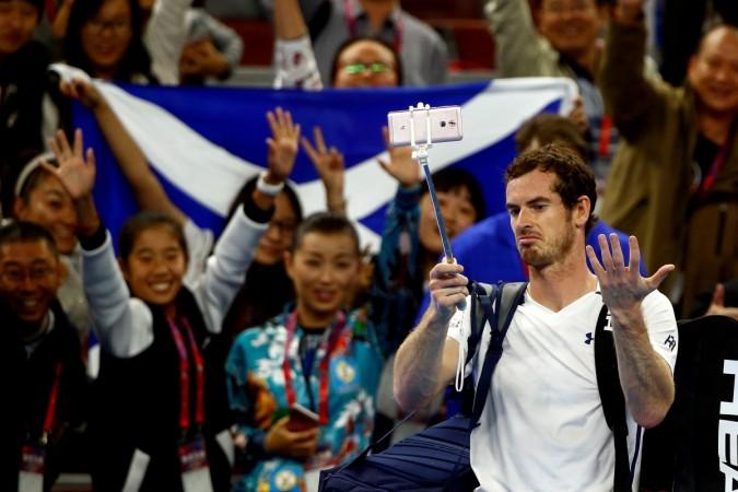 Andy Murray of Great Britain gestures at an malfunctioning selfie-stick after defeating Andreas Seppi of Italy in China Open andy murray