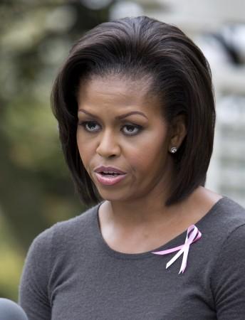 US' first lady Michelle Obama speaks at a Breast Cancer Awareness Month event in the First Lady's Garden at the White House in Washington, October 23, 2009. Michelle Obama