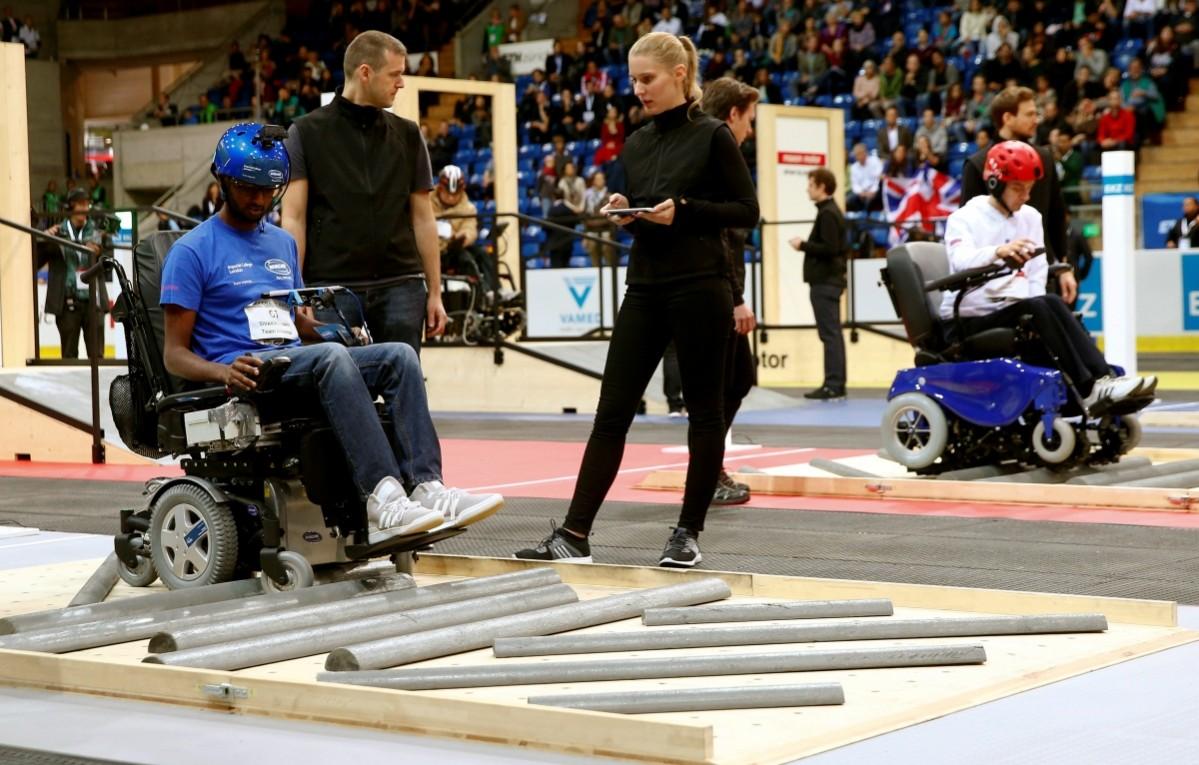 Britain's Sivashankar Sivakanthan and Yuri Larin (R) of Russia compete during the Powered Wheelchair Race at the Cybathlon Championships in Kloten, Switzerland October 8, 2016. CYBATHLON