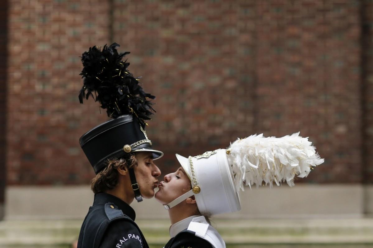 Revellers share a moment while they take part in the 70th Annual Columbus Day Parade in New York, October 13, 2014. Columbus Day Parade