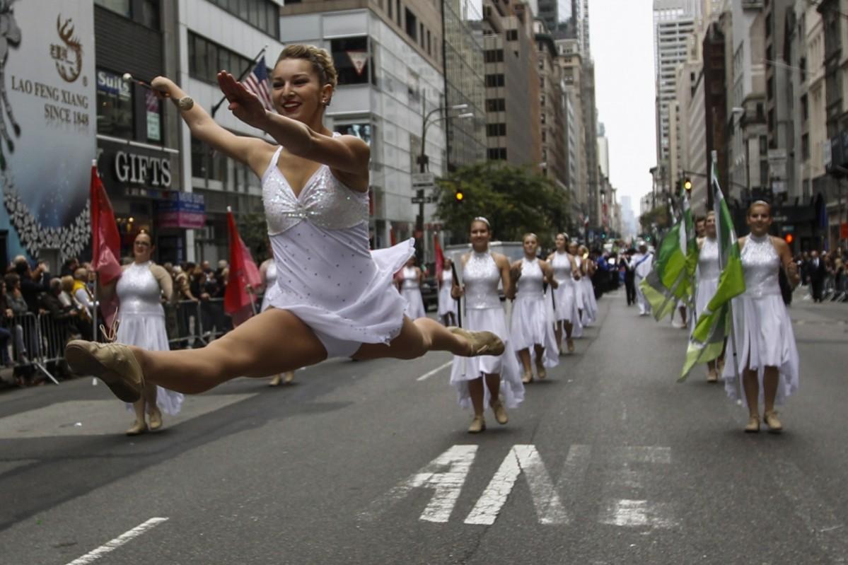 Revellers take part in the 70th Annual Columbus Day Parade in New York, October 13, 2014. Columbus Day Parade