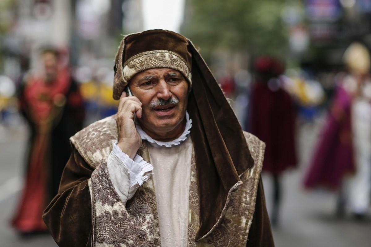 A reveller waits to march while attending the 70th Annual Columbus Day Parade in New York, October 13, 2014. Columbus Day Parade